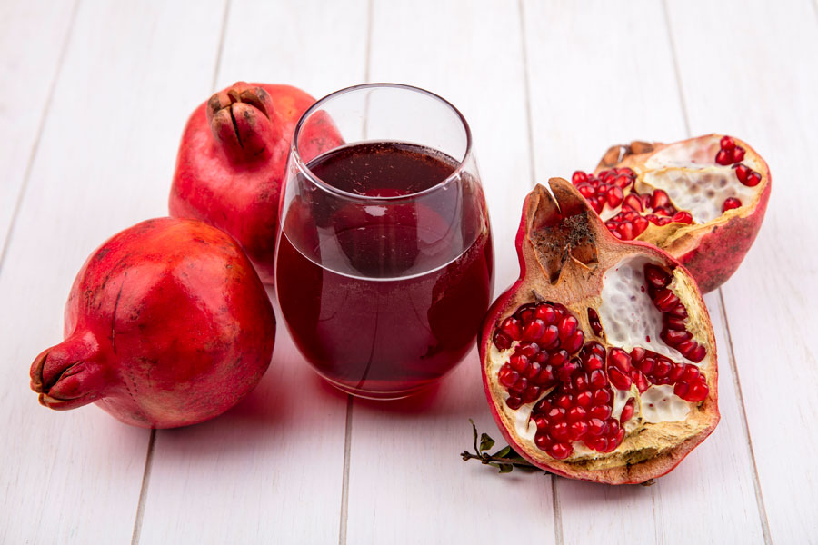 Pomegranate Juice , Natural pomegranate juice bottle, rich ruby color and healthy beverage option.