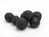 Black dried lemons with a dark, naturally dried appearance and rich citrus texture.