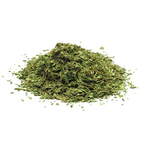 Dried tarragon leaves with fine texture, aromatic herb used in cooking and seasoning.