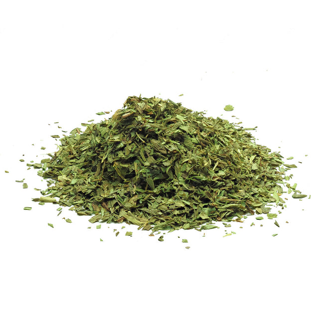 Dried tarragon leaves with fine texture, aromatic herb used in cooking and seasoning.